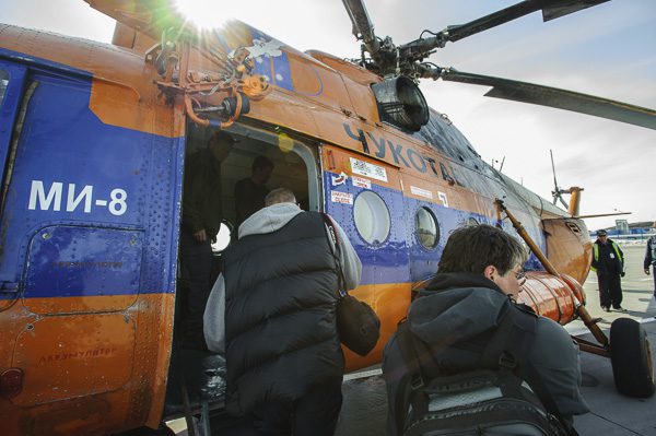 Team boarding the helicopter for flight to Meinypil