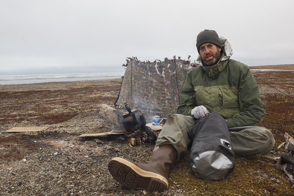 Gerrit Vyn takes a tea break on the tundra.