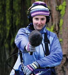 Laura Strickland using a shotgun microphone. by Erick Greene