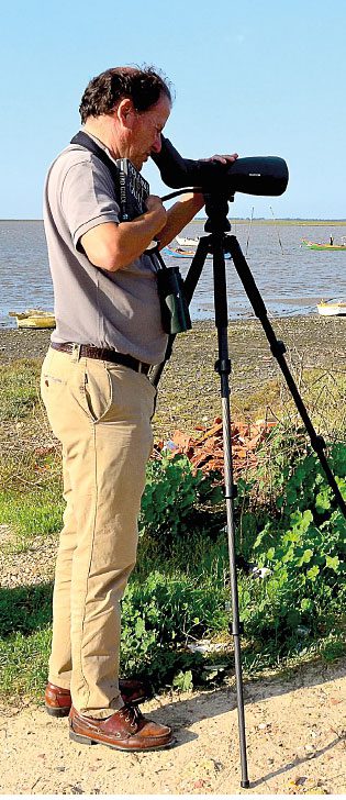 João Jara carefully scans a mudflat for shorebirds. He is one of the top birders in Portugal and has many first sightings for the country.