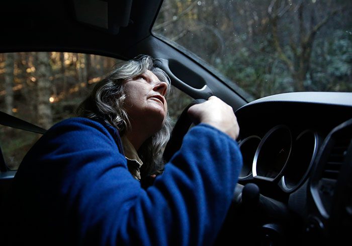 Janice Read looks for Spotted Owls while driving. Photo by Terray Sylvester