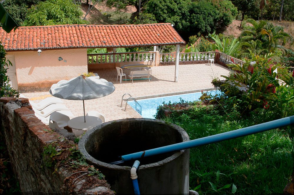 Water diverted from the land is used for both essential and recreational activity. Here, a pipe brings water down the hill for a backyard pool. Photo courtesy of CLO Multimedia.