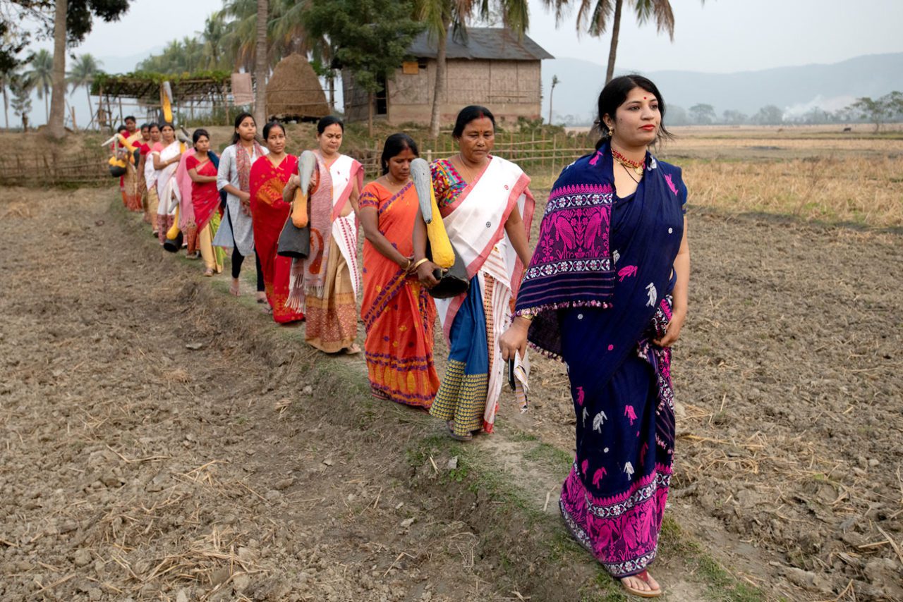 Conservation leader Purnima Barman and members of her hargila army practice a song and dance for a Greater Adjutant celebration in the village of Dadara in Assam, India. Photo by Gerrit Vyn.