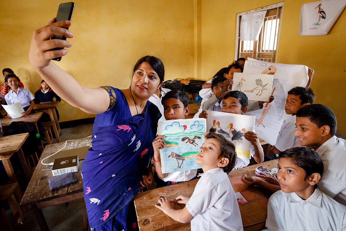 As part of her community outreach, Purnima Barman goes into schools to educate children about the Greater Adjutants that nest in their village. Photo by Gerrit Vyn.