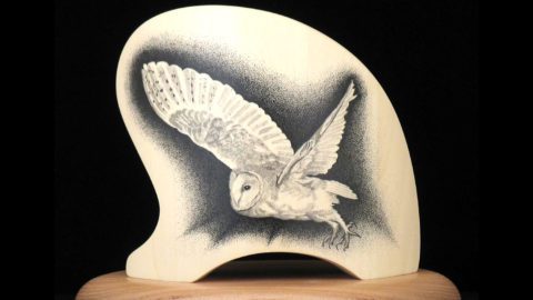 pointillist illustration of a Barn Owl on a piece of wood