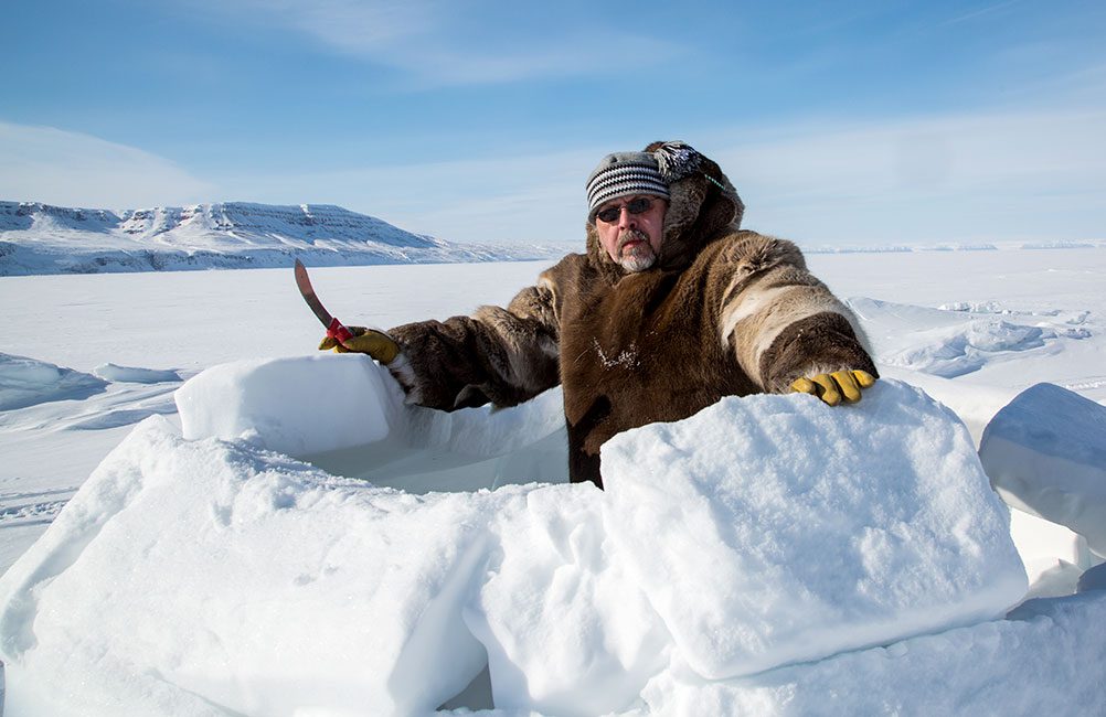 Clare Kines has been coordinating the Arctic Bay Christmas Bird Count for more than a dozen years. Here he builds an ice shelter. Photo by Clare Kines.