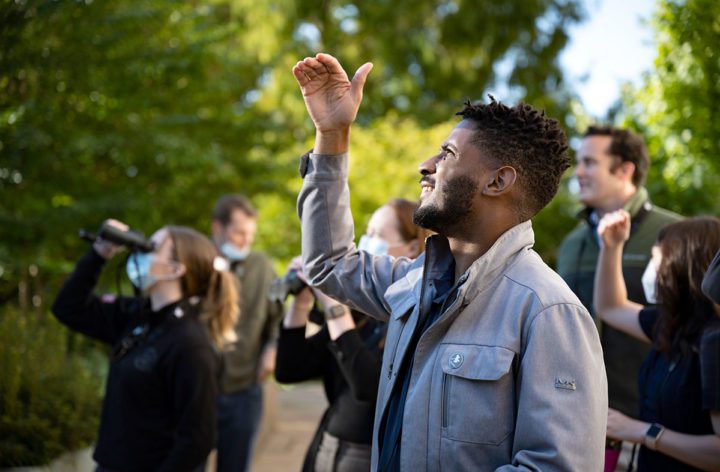 Tykee James says he loves to get first-time birders on his Capitol Hill bird walks so he can share in their excitement of seeing a bird and asking “What is that?” Photo by Chris Linder.