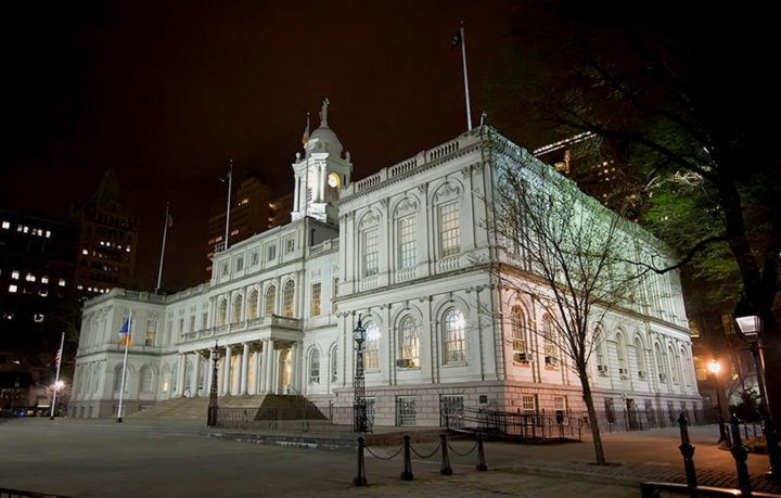 New York City Hall lit up at night. Photo by Rian Castillo/Creative Commons.