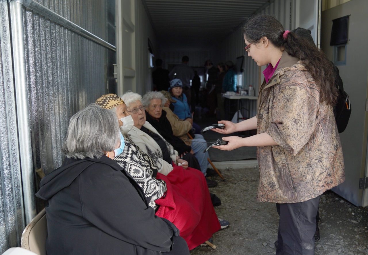A Yurok Tribe biologist speaks to a group of tribal elders