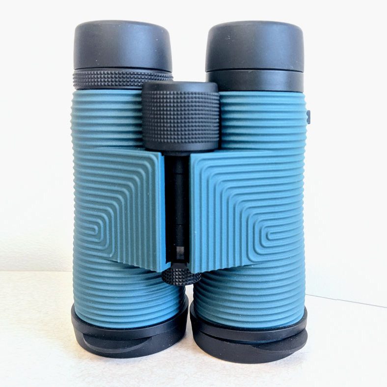 Binoculars with blue body and gray ends and eye pieces.