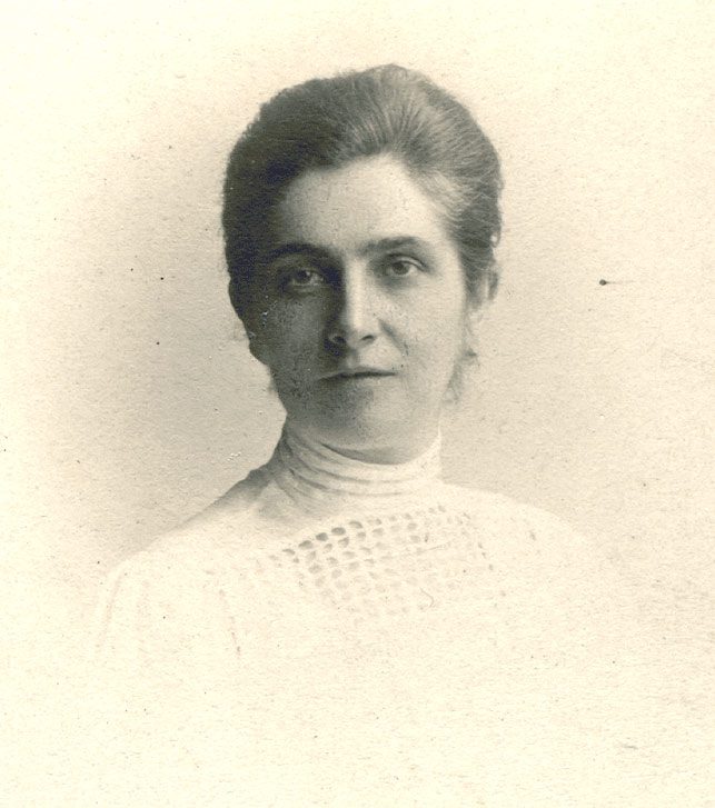 Sepia portrait of a woman from the early 20th century.
