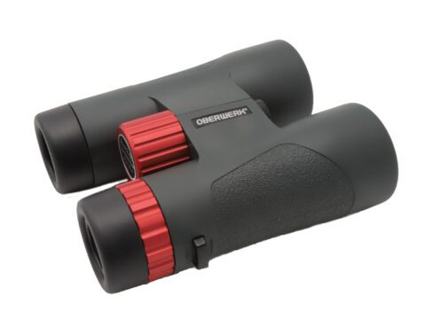 oblique view of a pair of roof prism binoculars with red highlights and 